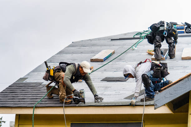Professional Emergency Roof Repair technician working in Whitestone, NY